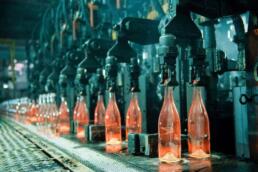 bottles going through steps of the assembly line