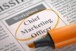 newspaper with job ad for a chief marketing officer